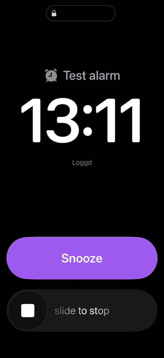 A loggd.life alarm ringing on an iPhone lock screen